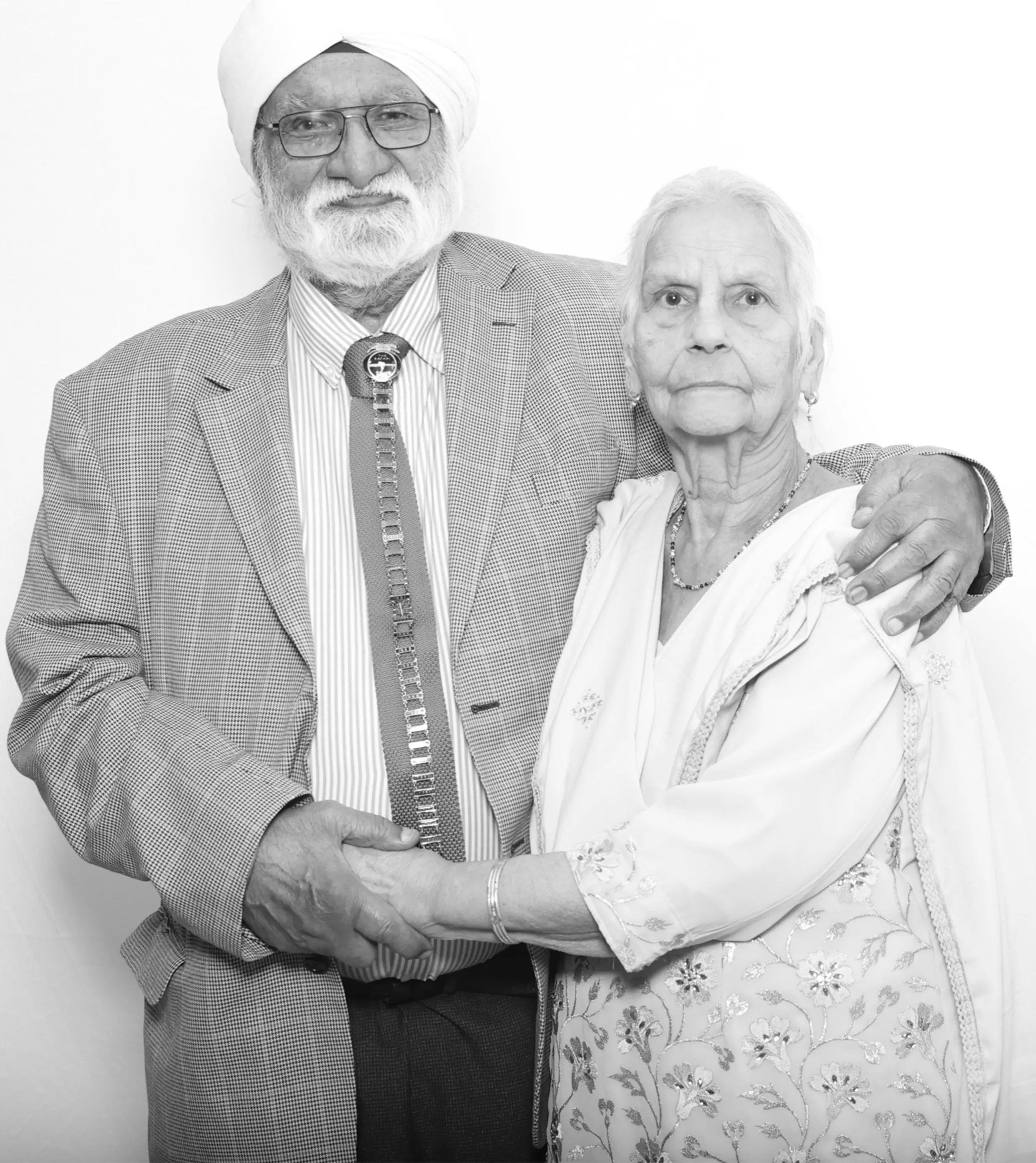 A grandmother and grandfather photographed together in a Khich Selfie booth, in black and white